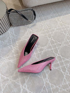 Pink crystal-embellished pointed-toe mule with stiletto heel, angled view