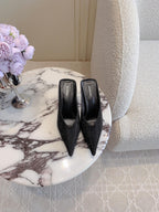 Black Balenciaga sandals with pointed toe and stiletto heel