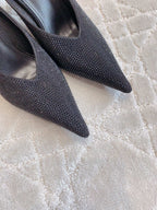 Black Balenciaga rhinestone slip-on mules with pointed toe, close-up