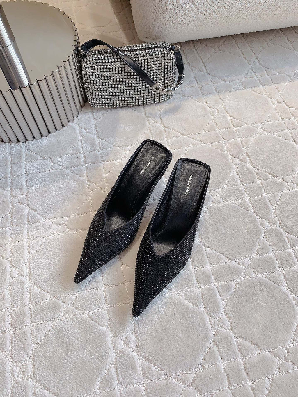 Black Balenciaga pointed-toe mules with stiletto heels, side view