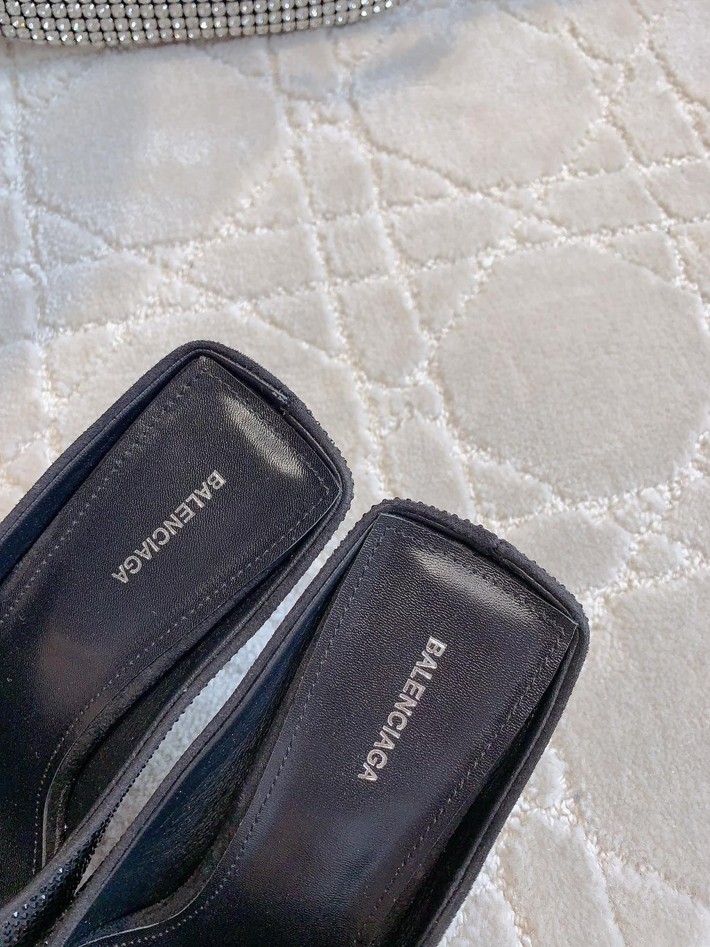 Black Balenciaga inner label on slip-on mules, open side view