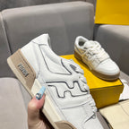 White unisex sneakers with tan suede heel panel and black logo trim detail.
