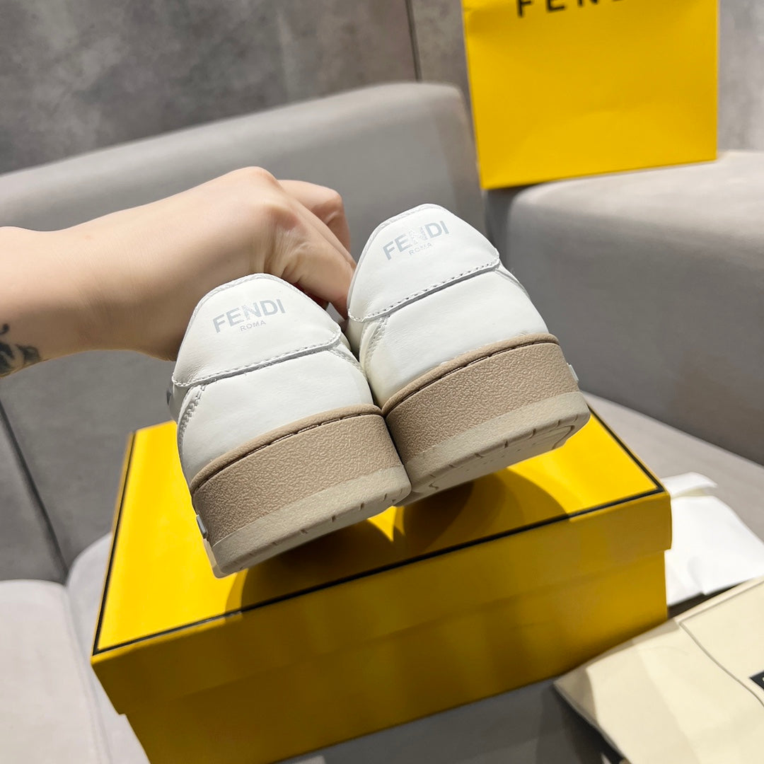 White unisex sneakers from back, showing Fendi logo on padded heel tabs.