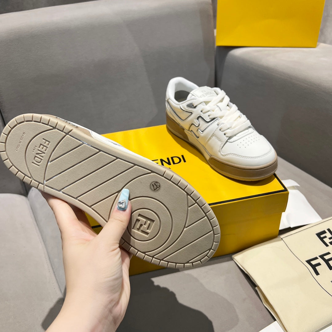 Unisex sneaker outsole with grey tread and Fendi logo stamp.