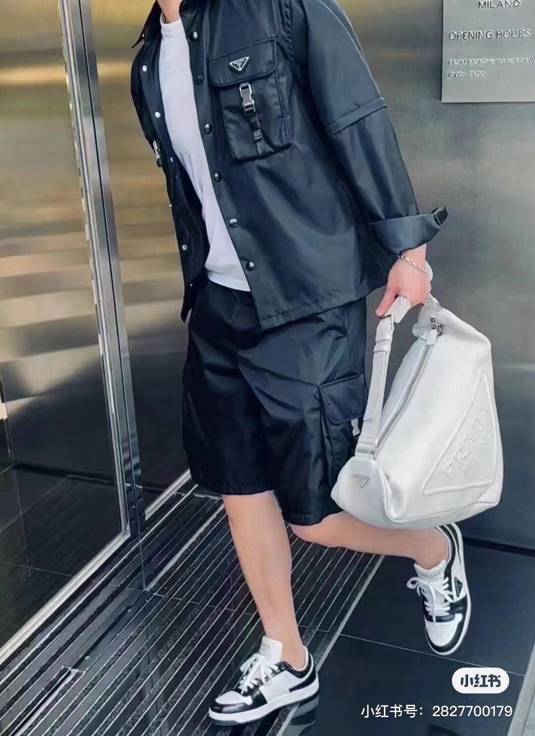 Black cargo shorts with side flap pockets and adjustable waistband