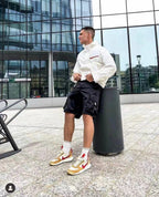Black cargo shorts with flap pockets and drawstring waist