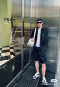 Black cargo shorts with flap pockets and drawstring waist