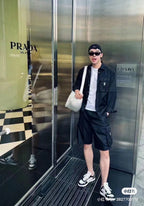Black cargo shorts with flap pockets and drawstring waist