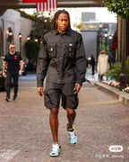 Black cargo shorts with front button placket and utility pockets