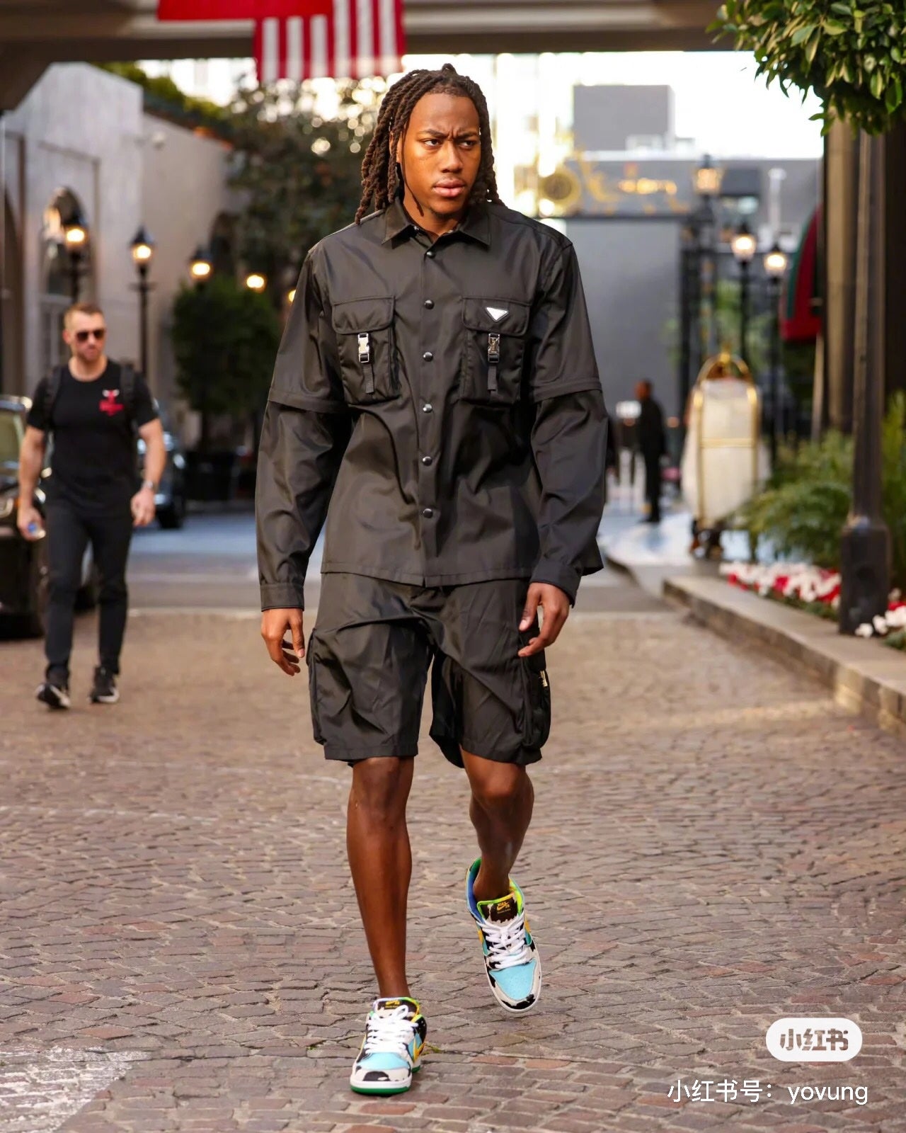 Black cargo shorts with front button placket and utility pockets