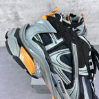Balenciaga unisex sneaker heel and side detail in black, silver, with orange support
