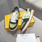 Fendi unisex sneakers side view on box, white laces with olive, black, and cream accents
