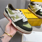 Fendi unisex sneakers shown in hand, white laces with olive and black colorblock and gum sole