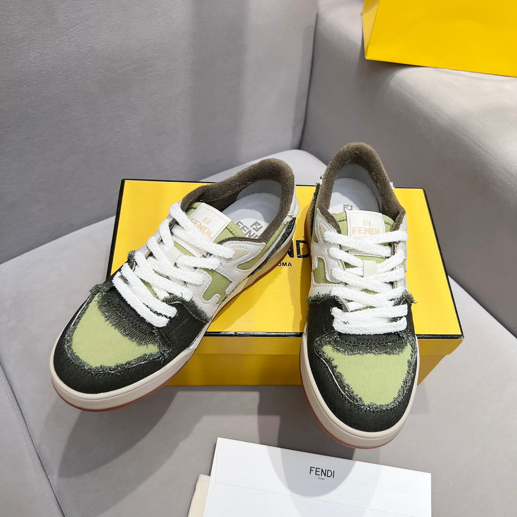 Fendi unisex sneakers front view on yellow box, white laces, olive-green and dark panels