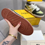 Fendi unisex sneaker outsole view, brown rubber tread with logo mark