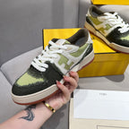 Fendi unisex sneakers held in hand, white laces, olive-green and black panels with gum sole
