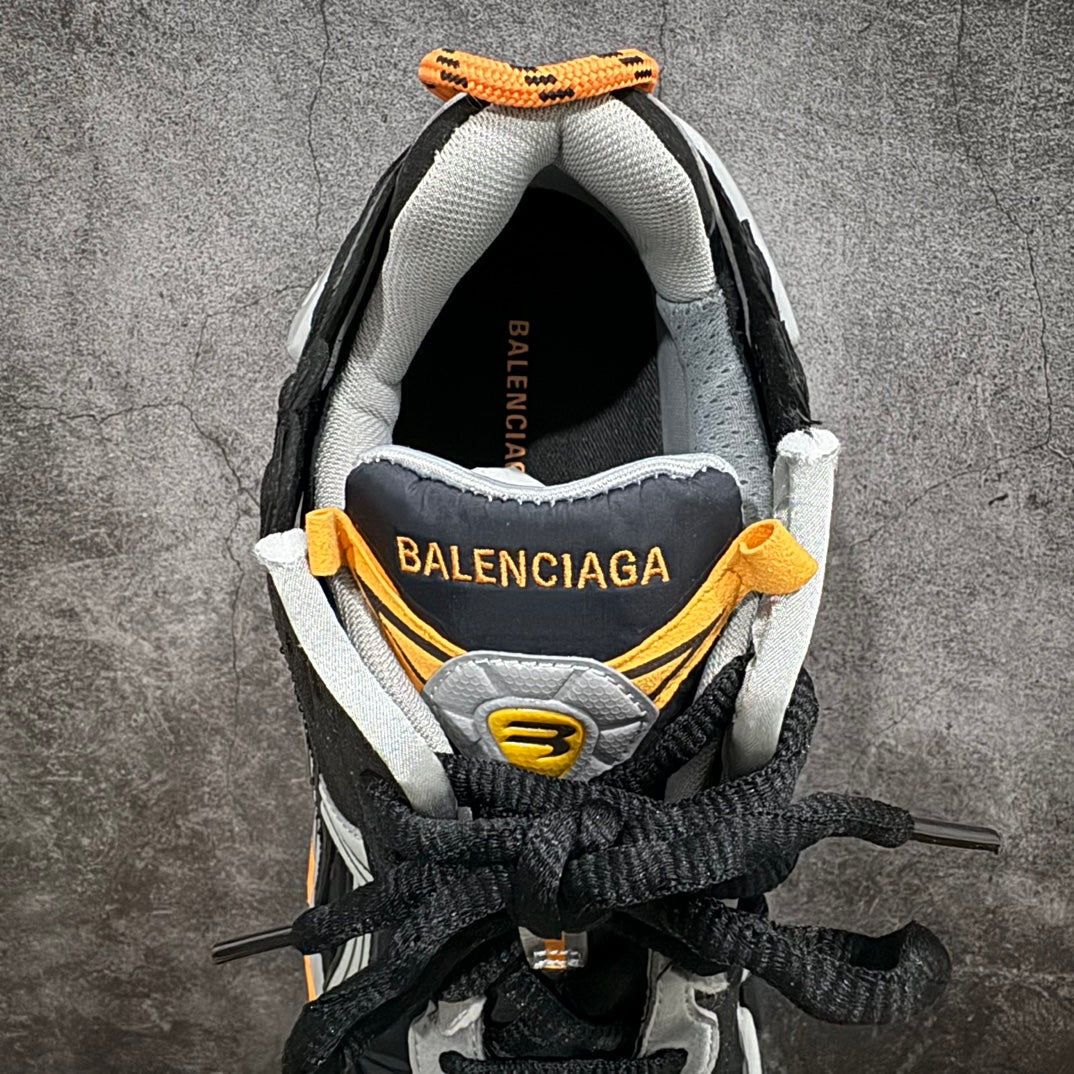 Inside view of black sneaker collar with gray lining and Balenciaga branding.