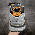 Back view of black and gray sneakers with orange pull tabs and size 41.