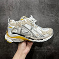 Balenciaga unisex sneakers, white and gray with yellow trim, lace-up design