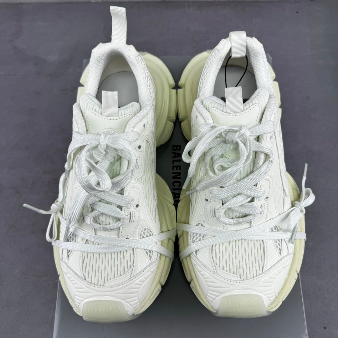 Pair of white lace-up sneakers with padded tongue and chunky light-cream soles