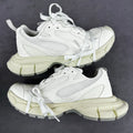 White lace-up sneakers with mesh panels and chunky light-cream sole
