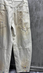 Balenciaga pants, light wash denim with paint splatter, close-up of front pocket and leg