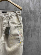 Balenciaga pants, light wash denim with paint splatter, close-up of waistband and label