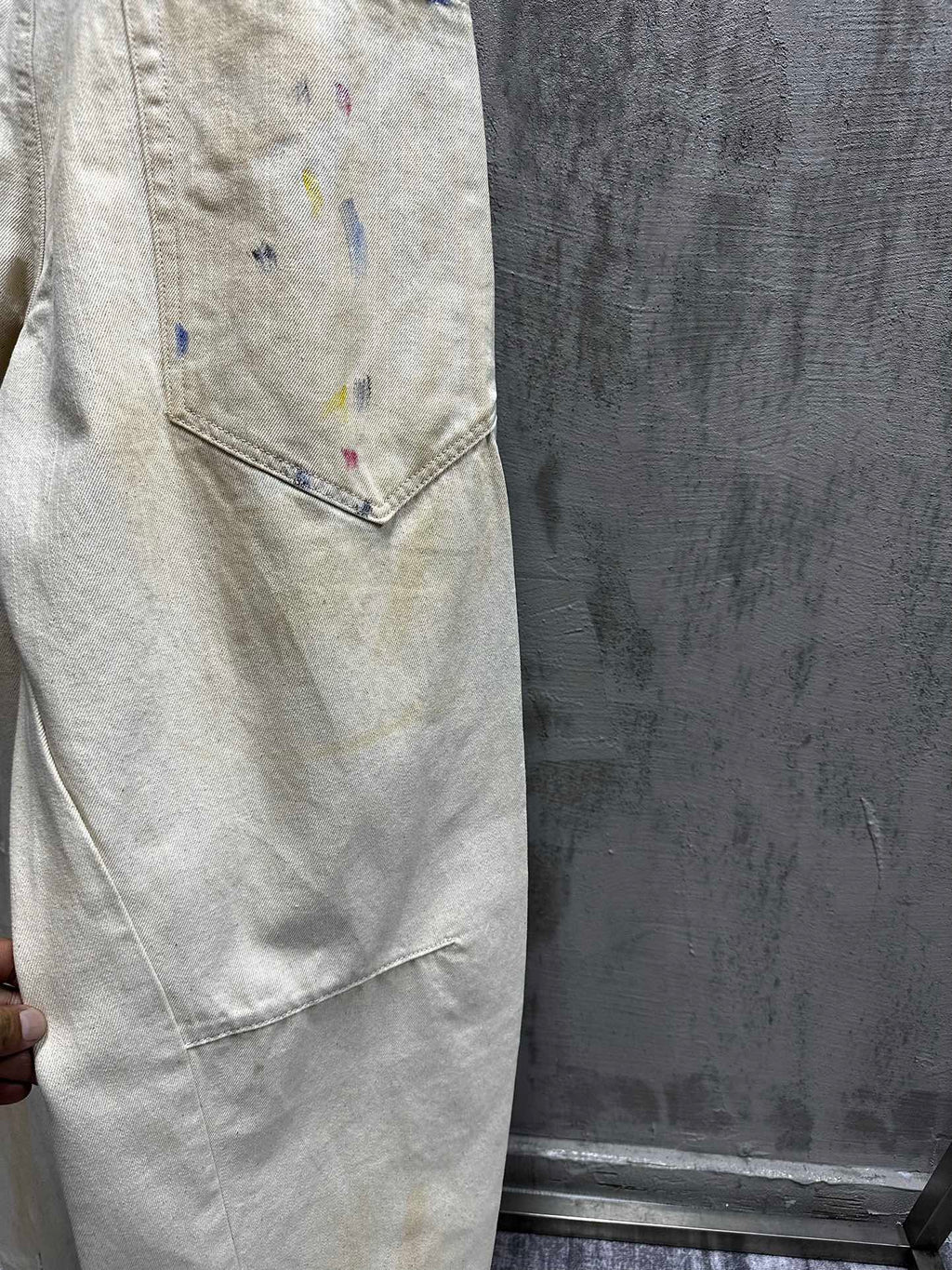 Balenciaga pants, light wash denim with paint splatter, side seam and hem detail