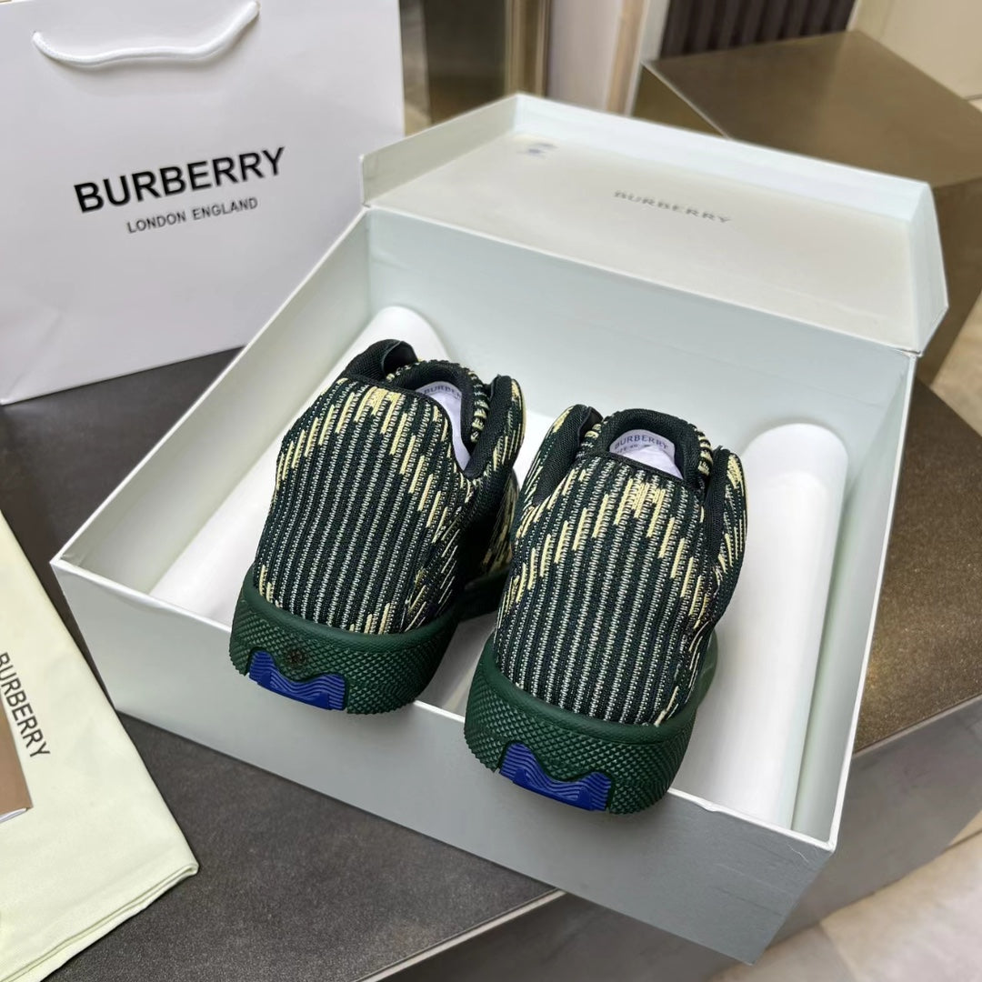 Back view of Burberry knit sneakers in dark green with yellow pattern, in box