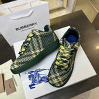 Pair of Burberry knit sneakers in dark green with yellow pattern, in a box