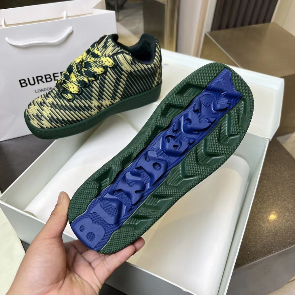 Burberry knit sneakers with yellow patterned uppers and blue traction sole