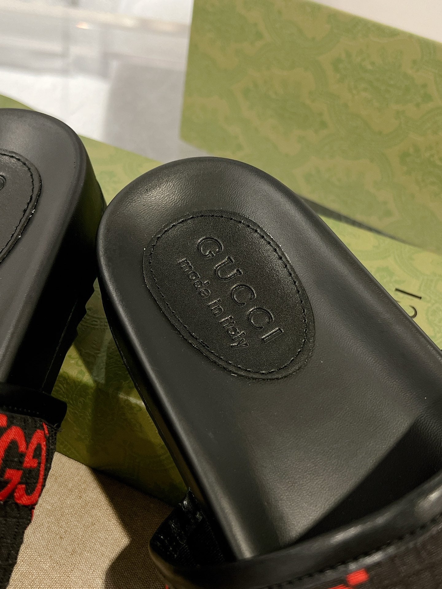 Black rubber slide footbed with Gucci logo stamp