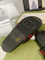Black rubber sandal outsole with Gucci logo tread pattern