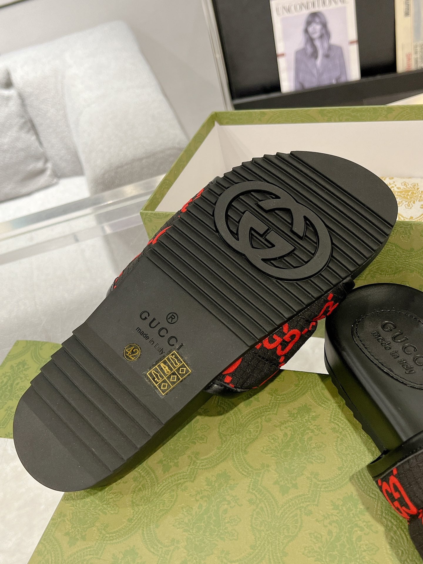 Black rubber sandal outsole with Gucci logo tread pattern