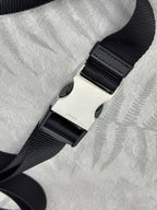 Adjustable black web strap with sliding clasp for crossbody bag