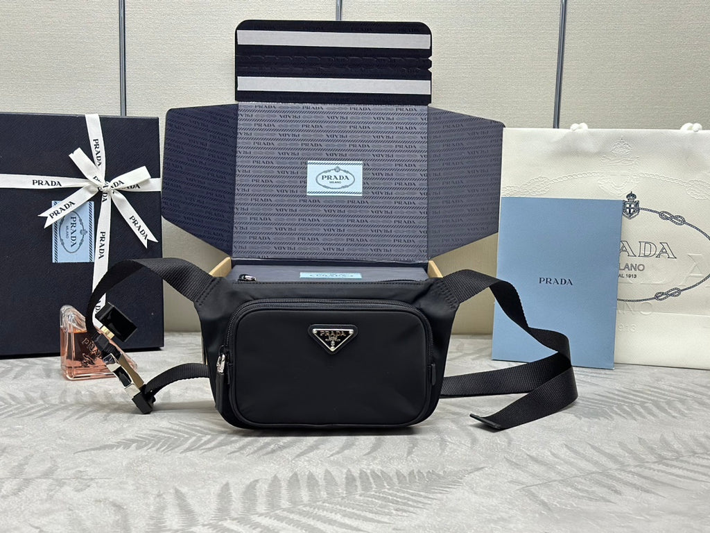 Prada black crossbody bag with adjustable web strap and triangular logo plaque