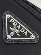 Black bag front logo patch with PRADA MILANO metal plate and stitched trim