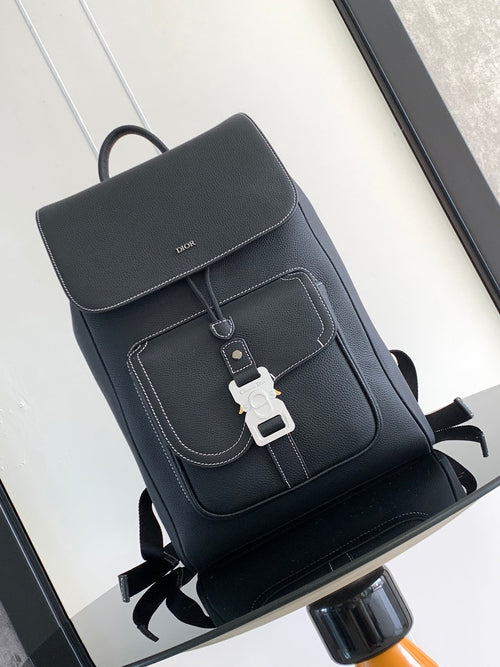 Men’s black leather backpack with front flap, stitched trim, and buckle closure