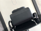 Black leather backpack front with smooth top flap and adjustable shoulder straps