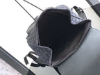 Dior men’s monogram backpack interior view, open top with leather trim and strap loops