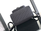 Dior men’s monogram backpack with front flap, side straps, and top handle