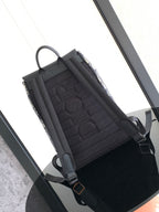 Men's Dior backpack, open side with black quilted lining and adjustable shoulder straps
