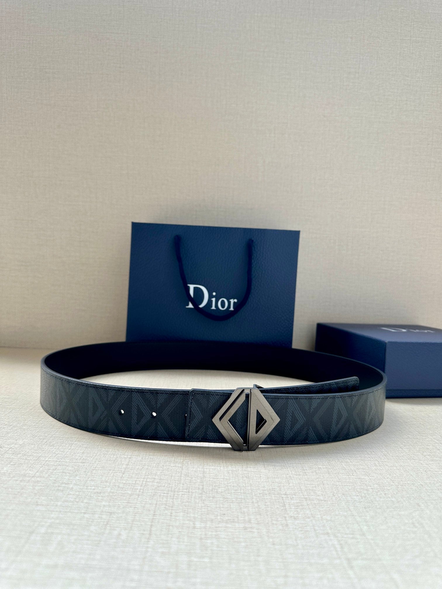 Dior belt with dark blue patterned strap and silver-tone geometric D buckle