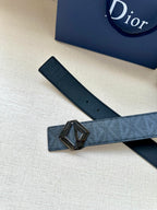 Dark blue patterned belt with silver-tone D buckle and perforated strap end