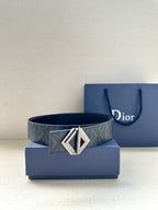 Dark blue patterned belt with silver-tone D buckle and pin holes