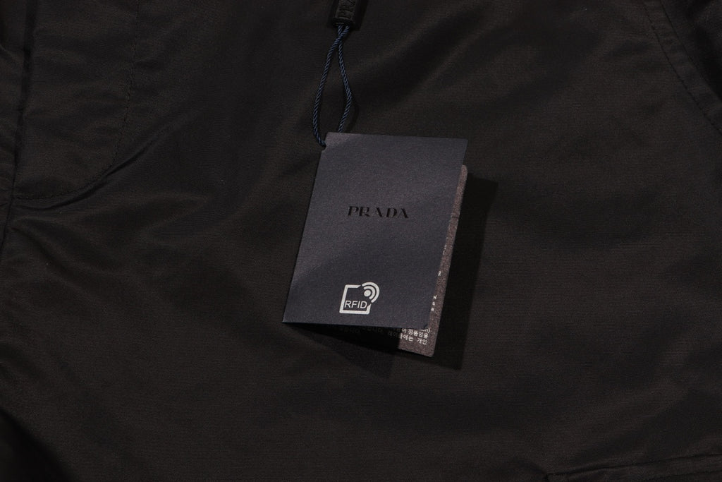 Prada fabric tag on black cargo shorts