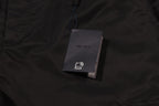 Prada fabric tag on black cargo shorts