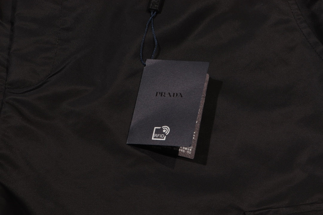 Prada fabric tag on black cargo shorts
