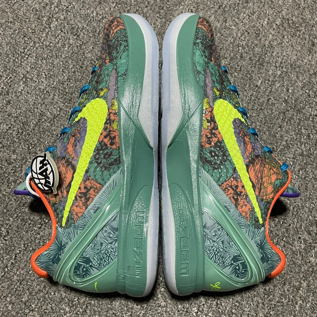 Nike Zoom Kobe 6 shoe backs with green heel panels, colorful print uppers, and blue laces