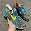 Nike Zoom Kobe 6 basketball shoes with green sole, blue laces, and colorful reptile print